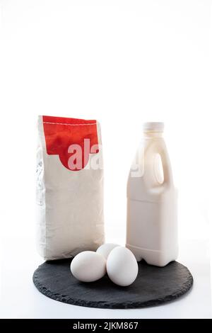 Eggs, milk and flour. Products for baking. Products for making dough. Stock Photo