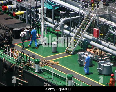 Bunkering tanker container ship in port Stock Photo