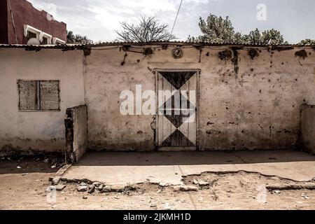 The exterior of an aged house in The Gambia Stock Photo