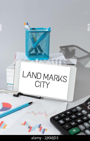 Writing displaying text Land Marks City. Business concept Important architecture places in the cities to visit Important Idea Shown On Phone On Desk Stock Photo