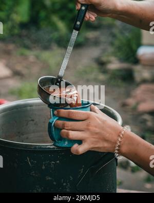 Serving a cup of organic cacao in Costa Rica Stock Photo