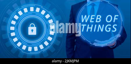 Conceptual caption Web Of Things. Business overview Internet technology online modern data service communication Businessman Presenting Important Stock Photo