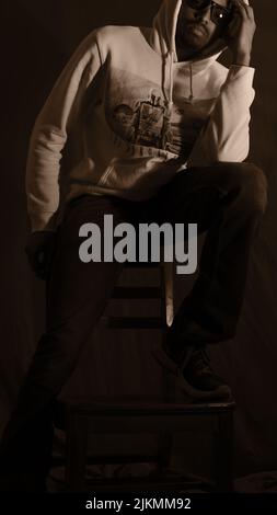 A cool young African American young guy posing in a studio Stock Photo