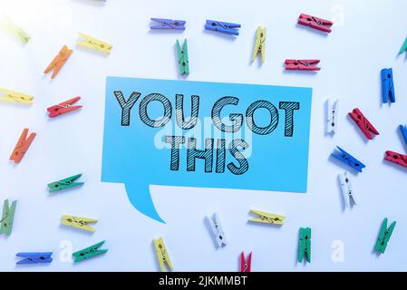 Text sign showing You Got This. Internet Concept Inspiration to do it understanding Motivation Positivity Colorful Pegs Placed Around Speech Bubble Stock Photo