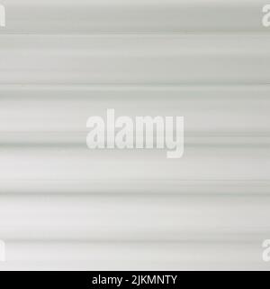 A light gray corrugated metal roofing texture background Stock Photo