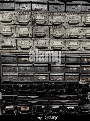 An old, dirty and rusty mailboxes with colors gray and black Stock Photo
