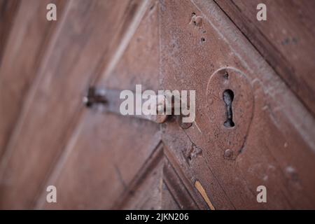 A close up shot of a lock on an old, rusty door Stock Photo
