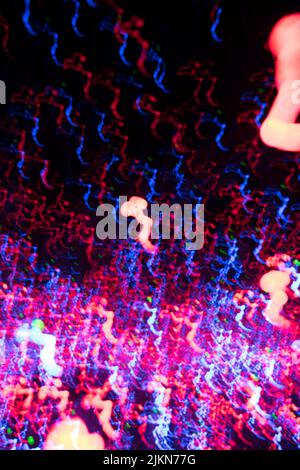 An abstract colored light lines on a black background, light art Stock Photo
