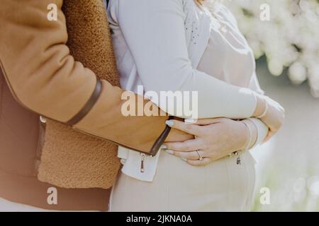 A close-up of a man hugging his wife Stock Photo