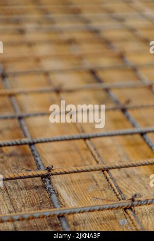 A vertical shot of a rusty concrete reinforcement steel bars Stock Photo