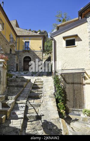 A narrow old street paved with stone. Stairs leading up, Castelmezzano is a village in the Basilicata region of Italy. Stock Photo