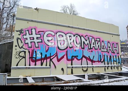 Euromaidan as text on ukrainian language from small papers on stone wall on Euro maidan meeting in Kiev. Meeting devoted to declining of Ukraine for Stock Photo