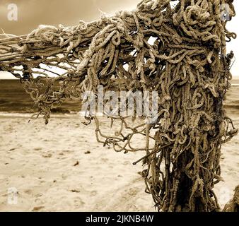 The Cashel braided rope and the sand Stock Photo
