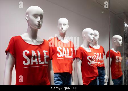 mannequins are dressed in t-shirts with the inscription sale Stock Photo