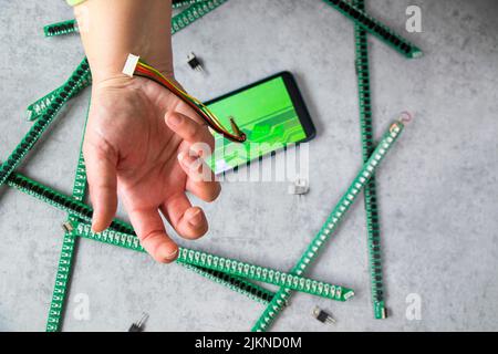 Cable and mobile, motherboard parts, digital communication, cellphone addicted and obsession Stock Photo