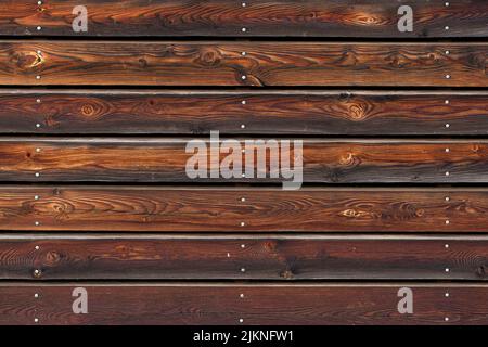 A beautiful wooden background with shiny screw heads. Simply a great texture. Stock Photo