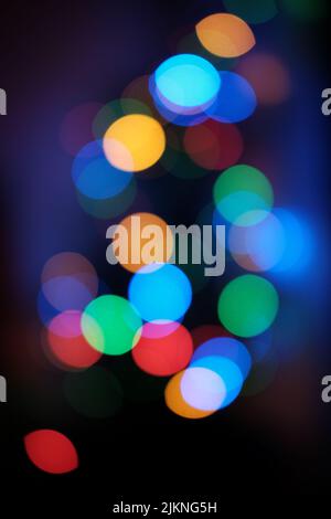 Abstract colorful glowing bokeh lights at night Stock Photo