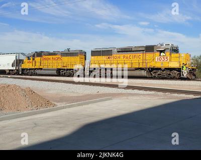 Two Union Pacific engines pulling another car Stock Photo