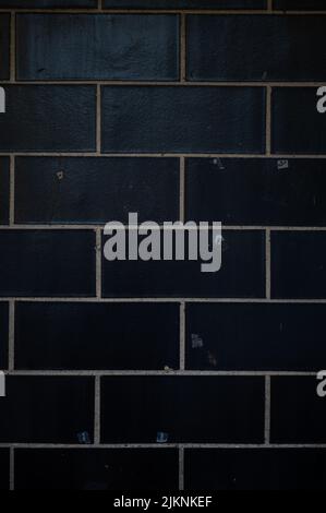 A vertical closeup shot of a white brick wall surface Stock Photo