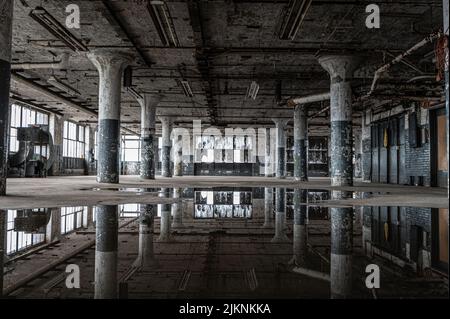 The reflection of the abandoned old hall on the water surface. Stock Photo