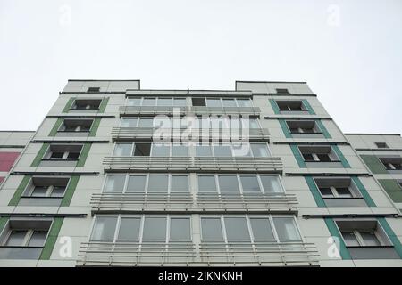 Building in city. Architecture details. Lots of windows in house. Urban development. Stock Photo
