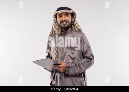 portrait of asian male with turban using a tablet Stock Photo