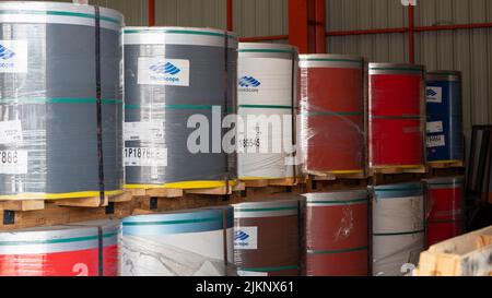 Rolls of galvanized steel sheet Scrap material stainless rolls Aluminium rolls inside the factory or warehouse. Stock Photo