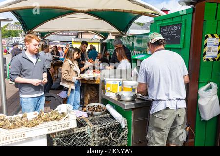 Seafood Hut green shack Oban pier and port in Scotland, chef cooking ...