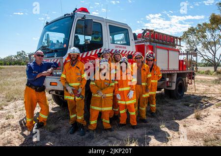 Volunteer country fire service members at a Sunday morning training session with their senior supervisor in New South Wales, Australia Stock Photo