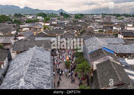 August 3, 2022 - Baisha, China: Aerial view of people celebrating the Torch Festival in Baisha old town near Lijiang, Yunnan Stock Photo
