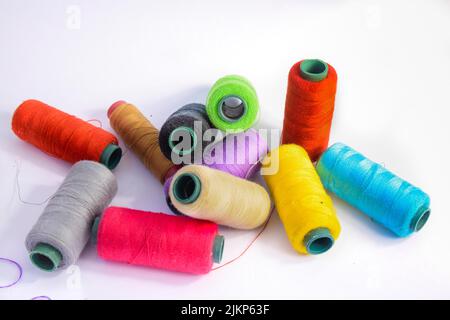 Vibrant colorful threads on a white background Stock Photo