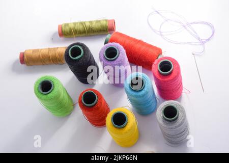 Vibrant colorful threads on a white background Stock Photo