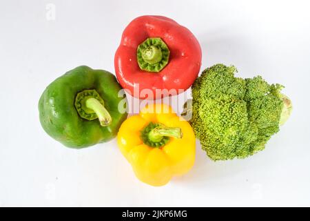 Fresh peppers and broccoli isolated on a white background Stock Photo