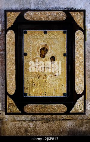 Icon in gilded cover on fur of the church of Virgin Mary the Blessed of Gelati monastery in Georgia Stock Photo