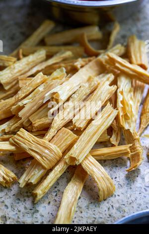 A pile of fresh yuba in the kitchen close-up Stock Photo - Alamy