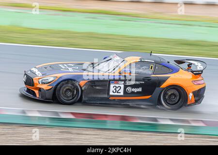 Fast race car in the wet track, Mercedes Benz AMG GT4 Stock Photo