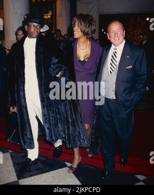 Bobby Brown, Whitney Houston and Clive Davis attend Clive Davis' Annual Pre-Grammy Grammy Party at the Plaza Hotel in New York City on February 24, 1998.  Photo Credit: Henry McGee/MediaPunch Stock Photo