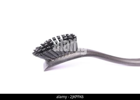 A closeup of a gray toothbrush isolated on a white background Stock Photo