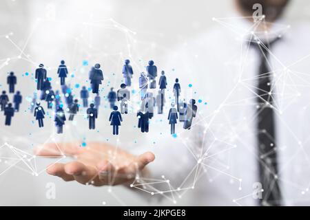 An illustrated network graphic with blue icons over a person's hand during a presentation Stock Photo