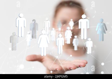 An illustrated network graphic with white icons over a person's hand during a presentation Stock Photo