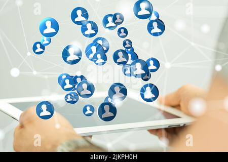 A 3D rendering of a group of floating people icons on a tablet  - communication concept Stock Photo