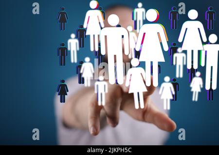A hand touching 3D rendered human icons, global digital connections concept Stock Photo