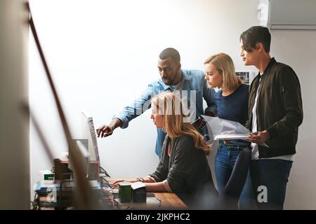 Group training, workshop and learning to brainstorm ideas and collaborate. Young diverse focused employees working as a team in the office. Coaching Stock Photo