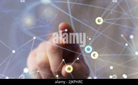 A closeup of a hand touching a 3D rendered scheme for a global networking concept Stock Photo