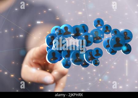 A closeup of a hand touching 3D rendered human icons for business and communications concept Stock Photo