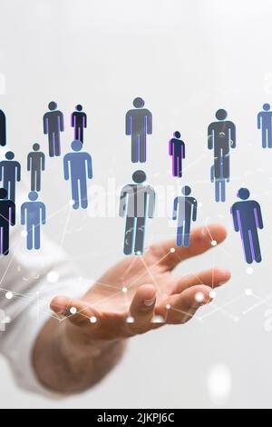 A 3D rendering of a group of floating people icons on a businessman's hand Stock Photo