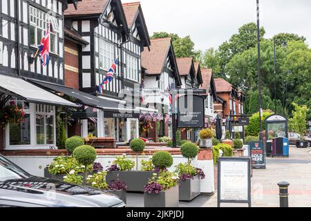 Whalley Lancashire England, Whalley is a village in the Ribble Valley, Tudor high street with union jacks flying and shops and stores,UK summer 2022 Stock Photo