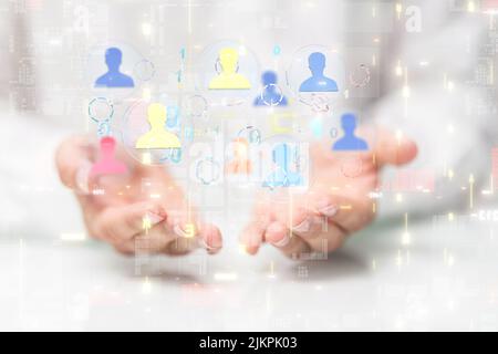 A 3D rendering of a group of floating people icons on a businessman's hand Stock Photo