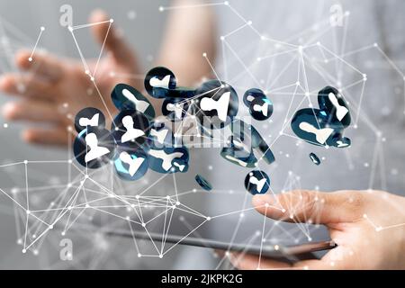 A 3D rendering of a group of floating blue people icons on a tablet  - communication concept Stock Photo