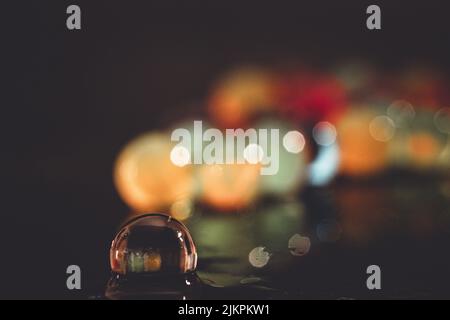 A water bead on a blurred background Stock Photo